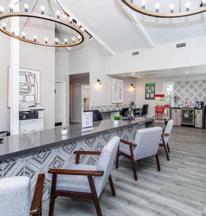 interior clubhouse with white counters and gray chairs