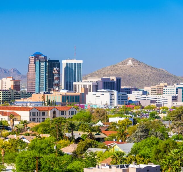city landscape with mountains in the background