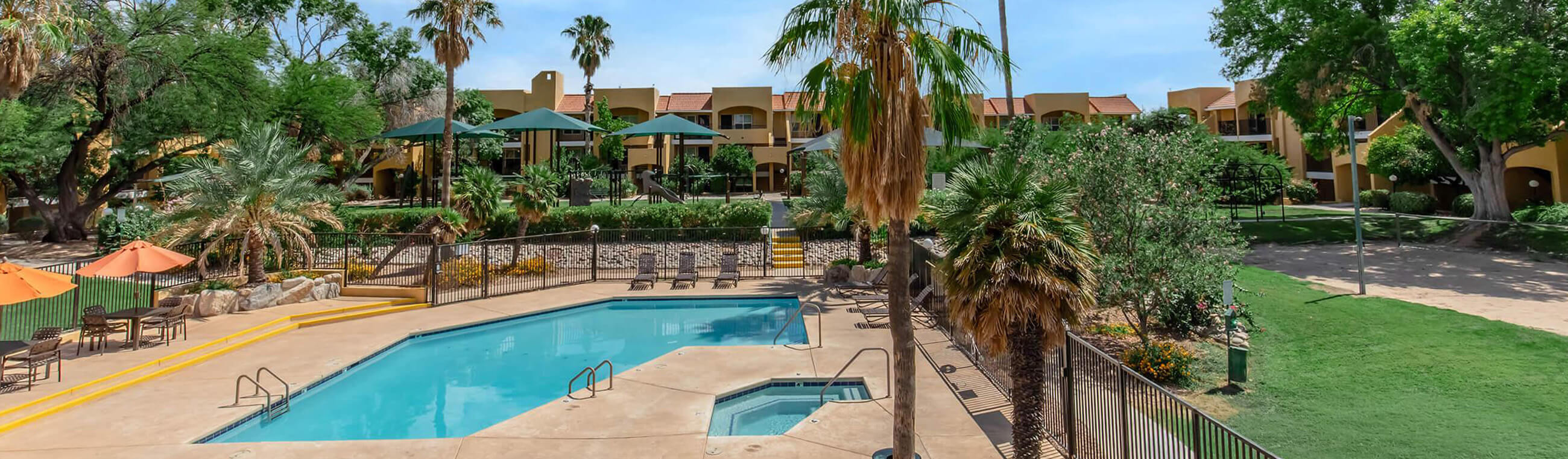 an exterior apartment with lawn and pool