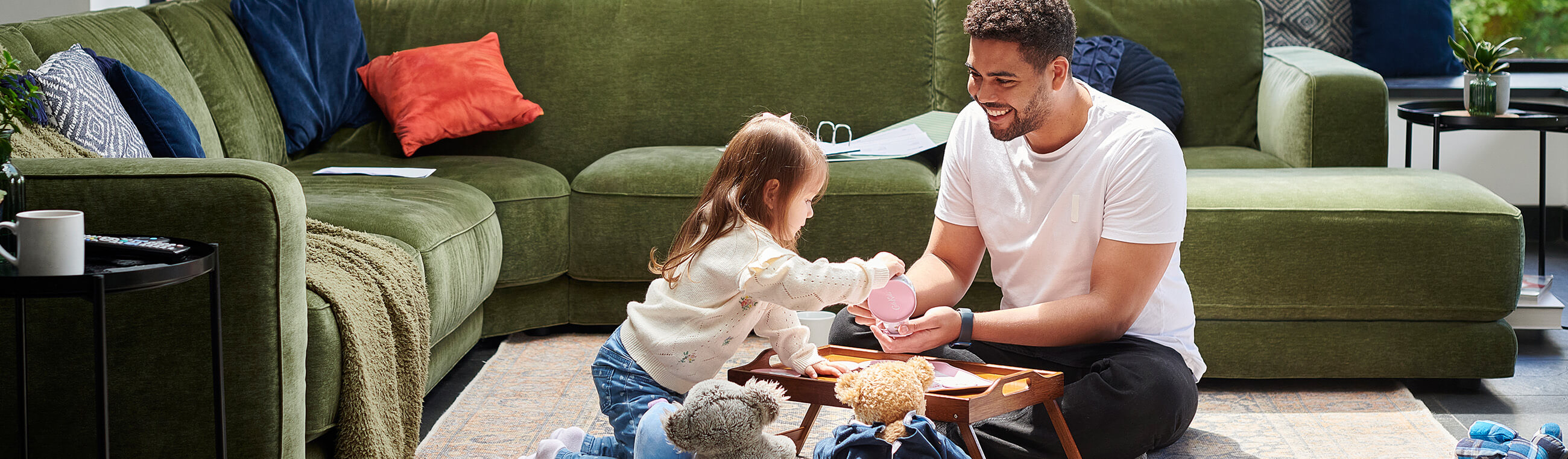dad and daughter playing in living room